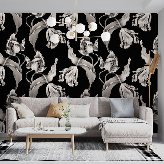 Living room with black and white twisting tulips wallpaper and a gray sofa.