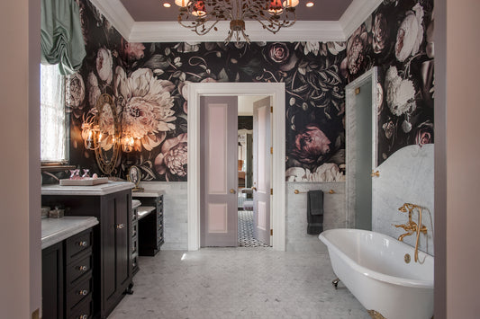 Bathroom with Dark Floral Wallpaper by Ellie Cashman with freestanding bathtub, and vanity.