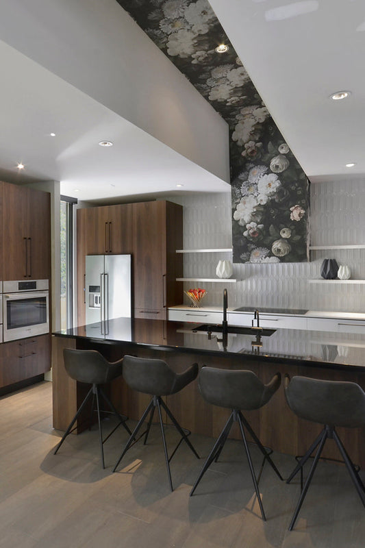 Floral Wallpaper Accent Wall in modern kitchen with wooden cabinets, marble countertops.