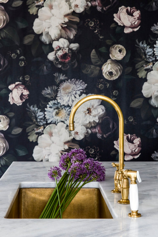 Dark Floral Wallpaper with gold faucet and sink with purple flowers