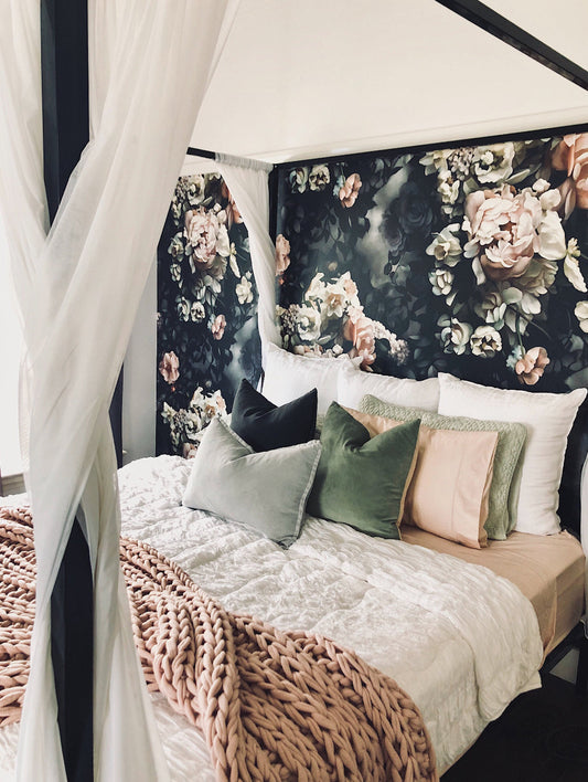 Ellie Cashman Floral wallpaper behind a canopy bed