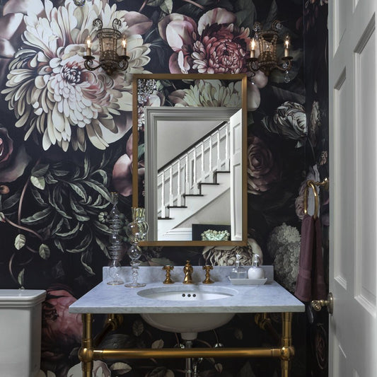 Dark Floral II Wallpaper by Ellie Cashman Design in powder room with bronze mirror and marble sink